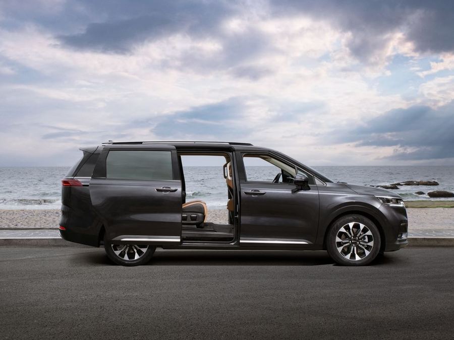 Dark grey people mover with its sliding door open